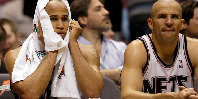 New Jersey Nets forward Richard Jefferson, left, in the dugout during a Houston Rockets game in East Rutherford, New Jersey on December 27, 2006.