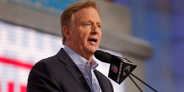 Roger Goodell speaks at the podium