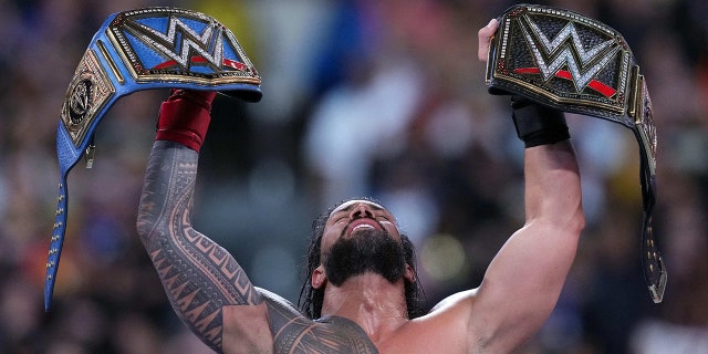 Roman Reigns celebrates victory during Wrestlemania Night 2 at SoFi Stadium.