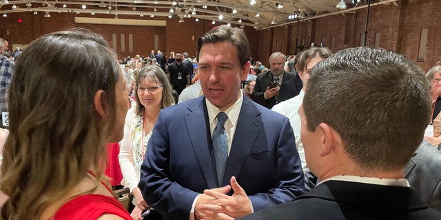 Florida Gov. Ron DeSantis greets GOP activists and leaders after headlining the New Hampshire GOP's annual fundraising dinner, on April 14, 2023 in Manchester, N.H. 