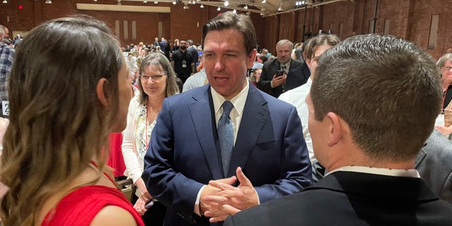 Florida Gov. Ron DeSantis greets GOP activists and leaders after headlining the New Hampshire GOP's annual fundraising dinner, on April 14, 2023 in Manchester, N.H. 