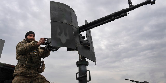 A Ukrainian soldier is seen at the Antonov airport in Hostomel, of Kyiv, Ukraine, Saturday, April 1, 2023. 