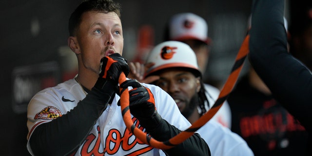 Ryan Mountcastle of the Orioles celebrates in the dugout after hitting a home run against the Oakland Athletics at Camden Yards on April 10, 2023, in Baltimore.