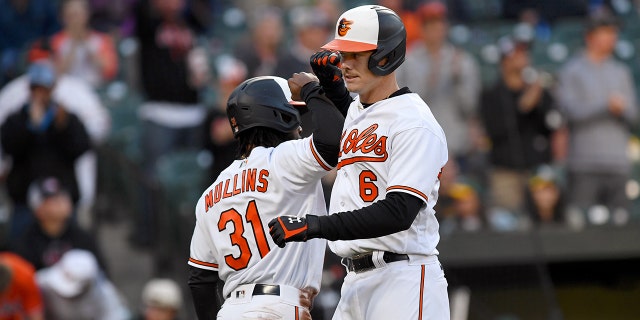 Baltimore Orioles first baseman Ryan Mountcastle celebrates with center fielder Cedric Mullins after his two-run homer against the Oakland Athletics at Camden Yards on April 10, 2023, in Baltimore.