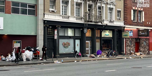 People inhabit encampments on the streets of San Francisco's Mission District.