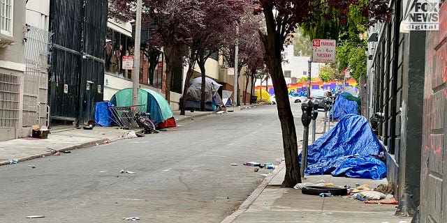 People inhabit encampments on the streets of San Francisco's Mission District.