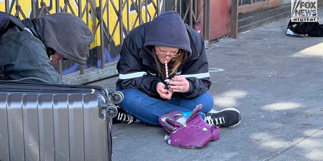 People inhabit encampments on the streets of San Francisco's Mission District.