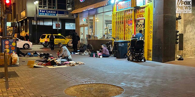 People inhabit encampments on the streets of San Francisco's Tenderloin District.