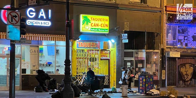 People inhabit encampments on the streets of San Francisco's Tenderloin District.