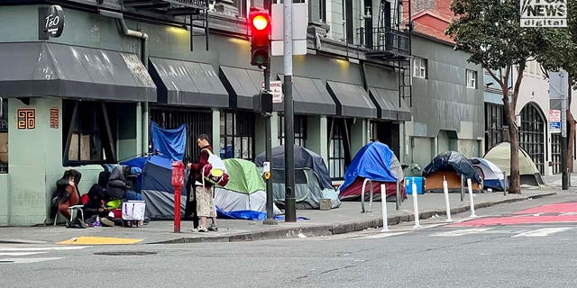 People inhabit encampments on the streets of San Franciscos Tenderloin District.