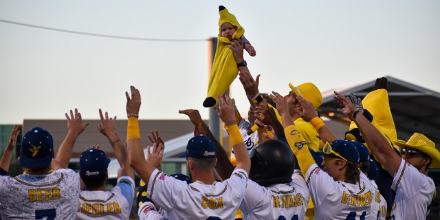 The Banana Baby of the game is chosen from among the crowd — and held up for the audience to see. 