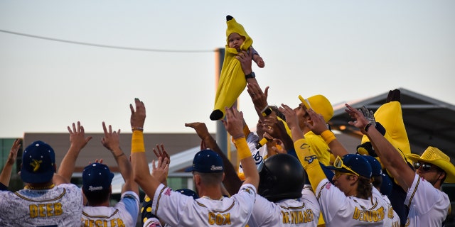 The Banana Baby of the game is chosen from among the crowd — and held up for the audience to see.