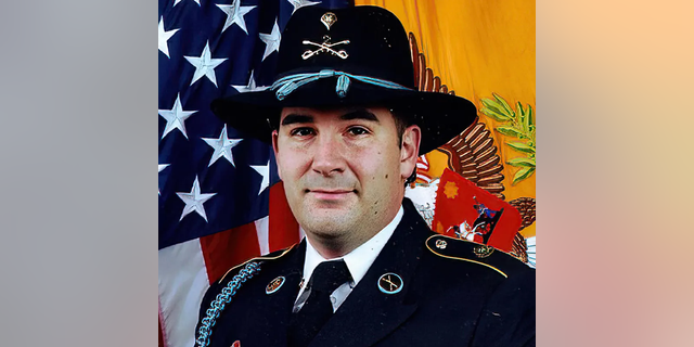A formal photo of U.S. Army Sergeant Daniel Perry, a man seeking pardon after being convicted of murdering a BLM protestor who pointed a gun in his face.