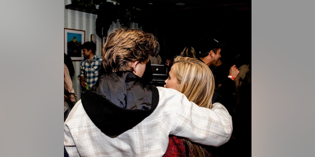 Deacon Phillippe shared a photo with mother Reese Witherspoon with their backs turned to the camera while sharing a hug.