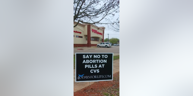 A 40 Days for Life sign is posted outside a CVS.