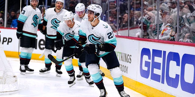 Seattle Kraken center Alex Wennberg (21) celebrates a goal against the Colorado Avalanche during the second period of Game 1 of a first-round NHL hockey playoff series Tuesday, April 18, 2023, in Denver.