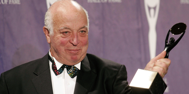 Seymour Stein receives an award after being inducted into the Rock and Roll Hall of Fame during an induction ceremony on Monday March 14, 2005 in New York.