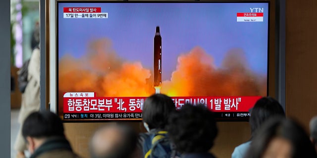 A TV screen is seen reporting North Korea's missile launch on Thursday, April 13, 2023, with file footage during a news program shown at the Seoul Railway Station in Seoul, South Korea.