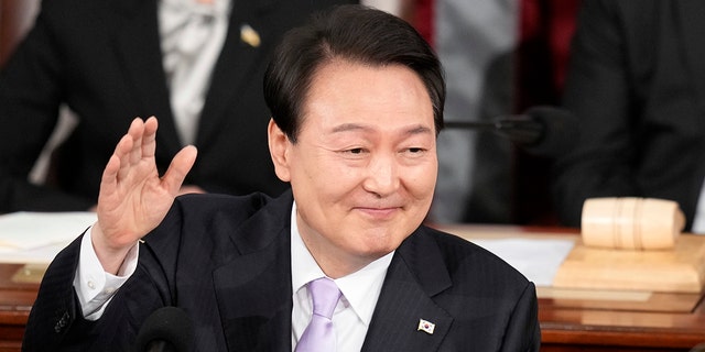 South Korea's President Yoon Suk Yeol waves to joint meeting of the US Congress