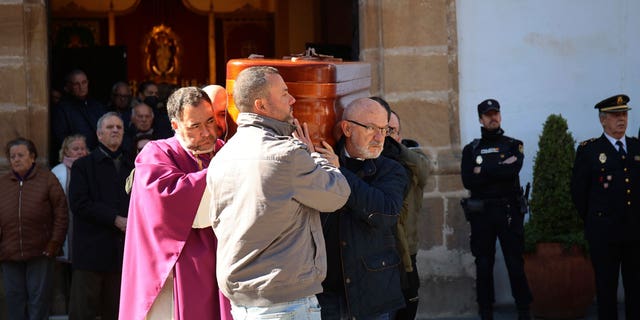 The coffin of the church sacristan who was killed during an attack is carried out of a church after a funeral mass in Algeciras, Spain, on Jan. 27, 2023. 