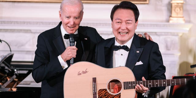 Yoon Suk Yeol, South Korea's president, holds a guitar