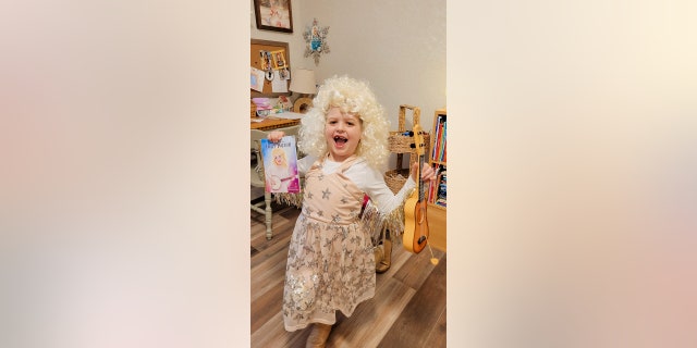 With the help of her mom, Dana Troglen, Stella put together a costume that closely resembled the picture of Dolly on the front of her book.
