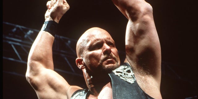 Steve Austin puts his hands up