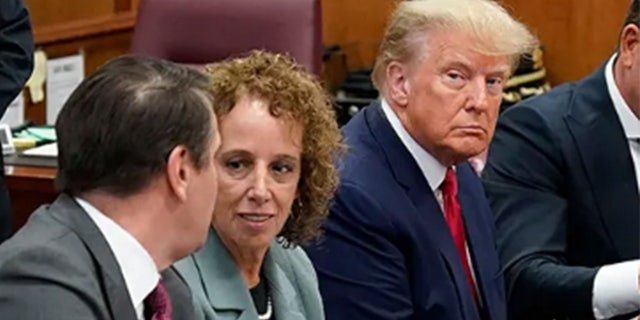 Former President Donald Trump sits at the defense table with his defense team in a Manhattan court during his arraignment on April 4, 2023, in New York City. 