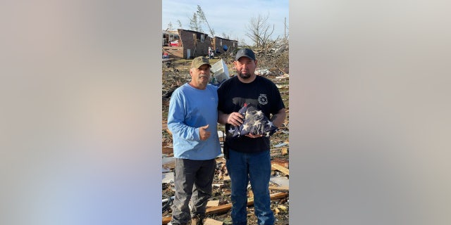 Dustin Pinckney (not pictured above) and a team of volunteers were able to recover his late grandfather's American flag that was lost in the rubble.
