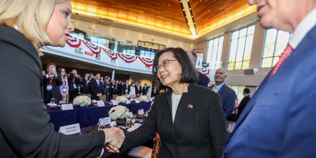 Taiwanese President Tsai Ing-wen, center, is greeted before a bipartisan leadership meeting at the Ronald Reagan Presidential Library in Simi Valley, California, on April 5, 2023.