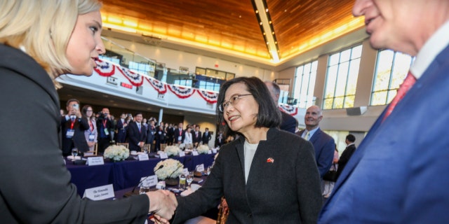 Taiwanese President Tsai Ing-wen, center, is greeted before a bipartisan leadership meeting at the Ronald Reagan Presidential Library in Simi Valley, California, on April 5, 2023.