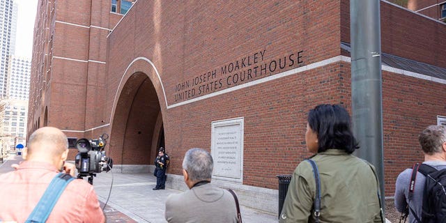 Media outside John Joseph Moakley United States Courthouse before the arraignment of Jack Teixeira on April 14, 2023, in Boston.