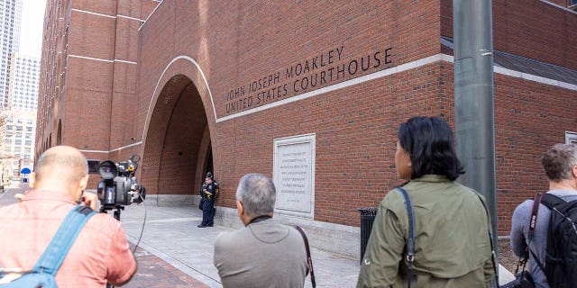 Media outside John Joseph Moakley United States Courthouse before the arraignment of Jack Teixeira on April 14, 2023, in Boston.