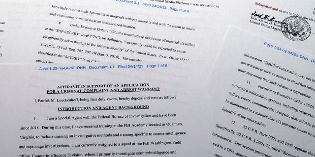 The affidavit in support of a criminal complaint and arrest warrant against Jack Teixeira is photographed