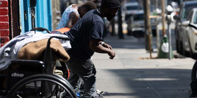 Homeless people in the Tenderloin district of San Francisco Sept. 24, 2022.