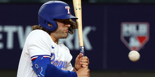 An open cut is seen on the cheek of Josh Smith #47 of the Texas Rangers after being hit by a pitch from Danny Coulombe of the Baltimore Orioles in the third inning at Globe Life Field on April 03, 2023 in Arlington, Texas.