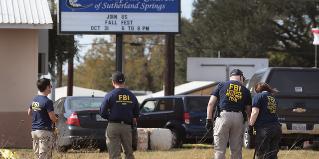 Law enforcement officials are seen outside the First Baptist Church of Sutherland Springs on Nov. 6, 2017, the day after the shooting.