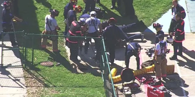 Crews rescued a Texas elementary school girl who got stuck in a storm drain head-first.