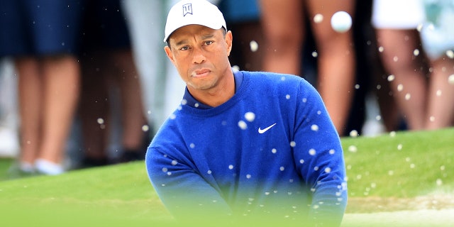 Tiger Woods plays his third shot on the 17th hole during a practice round prior to the 2023 Masters Tournament at Augusta National Golf Club on April 3, 2023 in Augusta, Georgia.