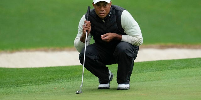 Tiger Woods lines up a putt on the 16th hole during the Masters on Saturday, April 8, 2023, in Augusta, Georgia.
