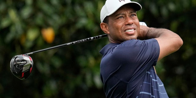 Tiger Woods watches his tee shot at the Masters on Friday, April 7, 2023, in Augusta, Georgia.