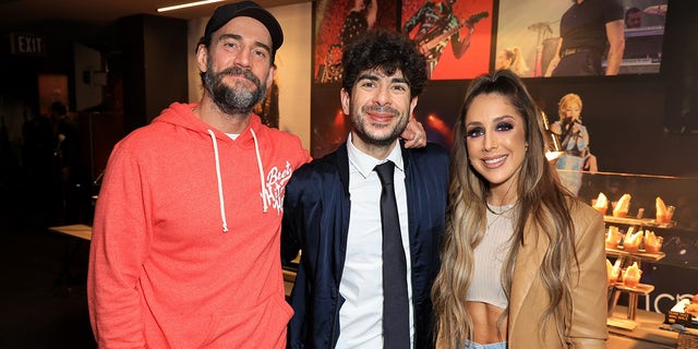 CM Punk, All Elite Wrestling President Tony Khan and Britt Baker, D.M.D., attend TBS's AEW Dynamite Los Angeles Debut After Party at The Forum on June 1, 2022 in Inglewood, California.