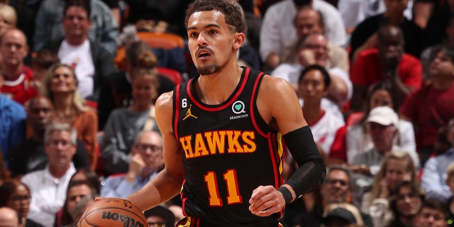 Trae Young #11 of the Atlanta Hawks dribbles the ball during the 2023 Play-In Tournament against the Miami Heat on April 11, 2023 at Kaseya Center in Miami, Florida.