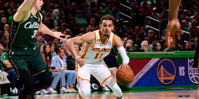 Trae Young (11) of the Atlanta Hawks drives to the basket during Game 1 of a 2023 NBA playoff series against the Boston Celtics April 15, 2023, at the TD Garden in Boston.