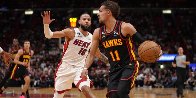 Trae Young #11 of the Atlanta Hawks handles the ball during the 2023 Play-In Tournament against the Miami Heat on April 11, 2023, at Kaseya Center in Miami, Florida.