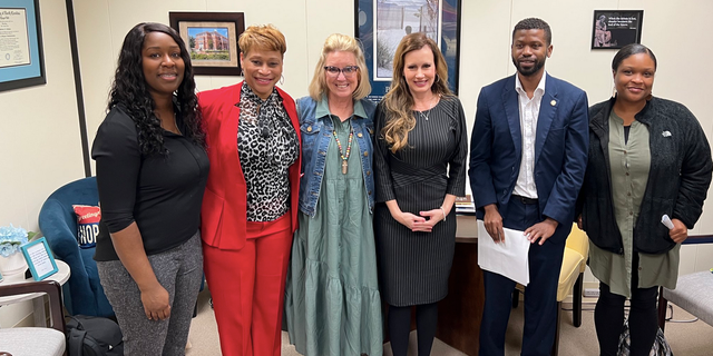 North Carolina state Rep. Tricia Cotham, third from right, is shown after a discussion with parents from Charlotte on education.