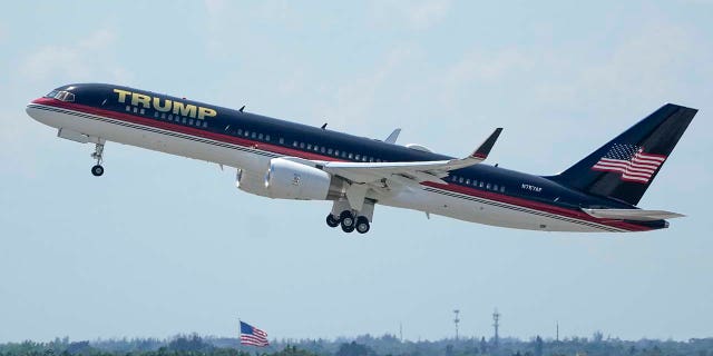 The plane carrying former president Donald Trump lifts off at Palm Beach International Airport, Monday, April 3, 2023, in West Palm Beach, Fla. Trump is heading to New York for his expected booking and arraignment on charges arising from hush money payments during his 2016 campaign.
