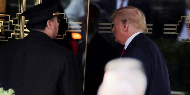 Trump enters Trump Tower on Monday.