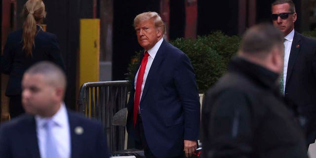 Former President Donald Trump arrives at Trump Tower, Monday, April 3, 2023, in New York, the day before his arraignment.