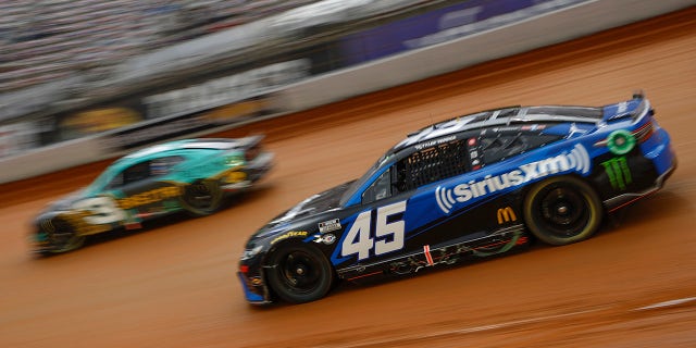 Tyler Reddick, driver of the #45 SiriusXM Radio Toyota, and Austin Dillon, driver of the #3 BREZTRI Chevrolet, race during qualifying heat # for the NASCAR Cup Series Food City Dirt Race on Dirt at Bristol Motor Speedway on April 08, 2023 in Bristol, Tennessee.